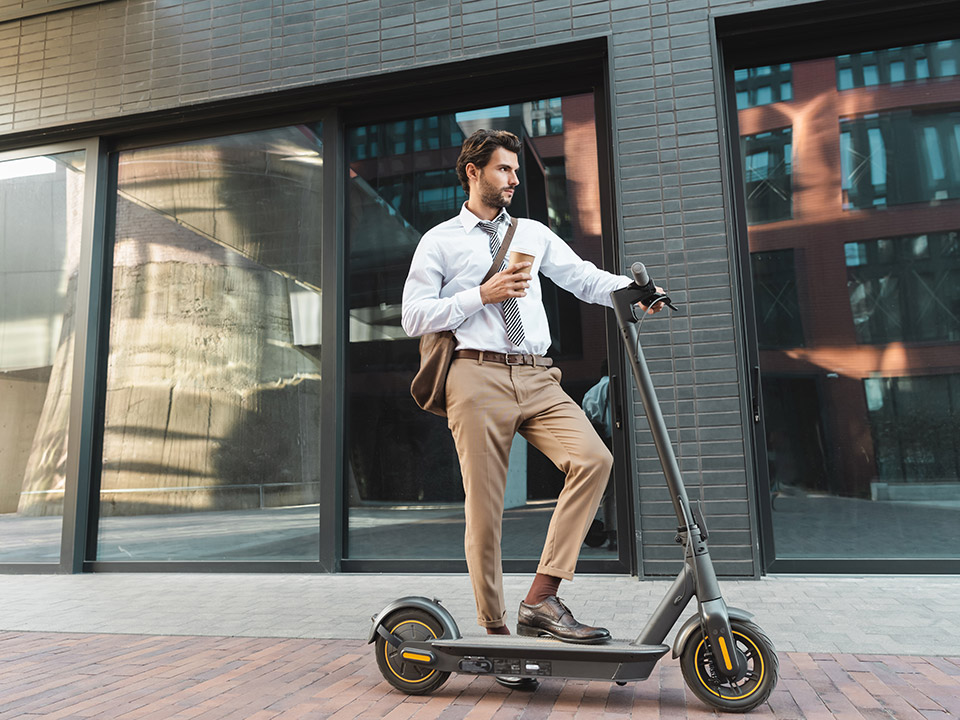 business man in electric scooter