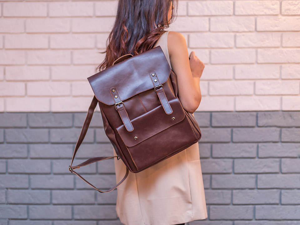 woman with Leather Backpack
